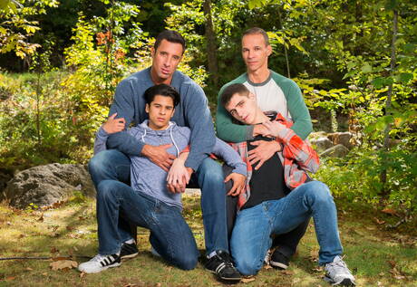 Hunk Nick Capra posing in jeans with young friends