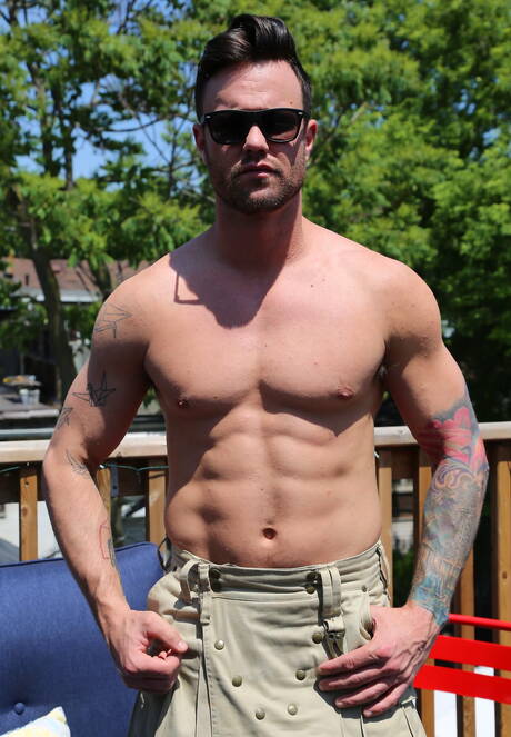 Black tough guy Trent King and canadian hunk Beau Reed in black on white sex outside