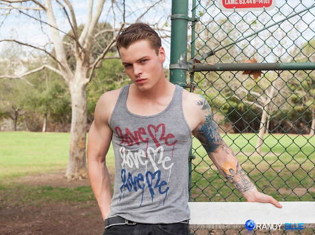 American muscular Zane Porter teasing his dick outside